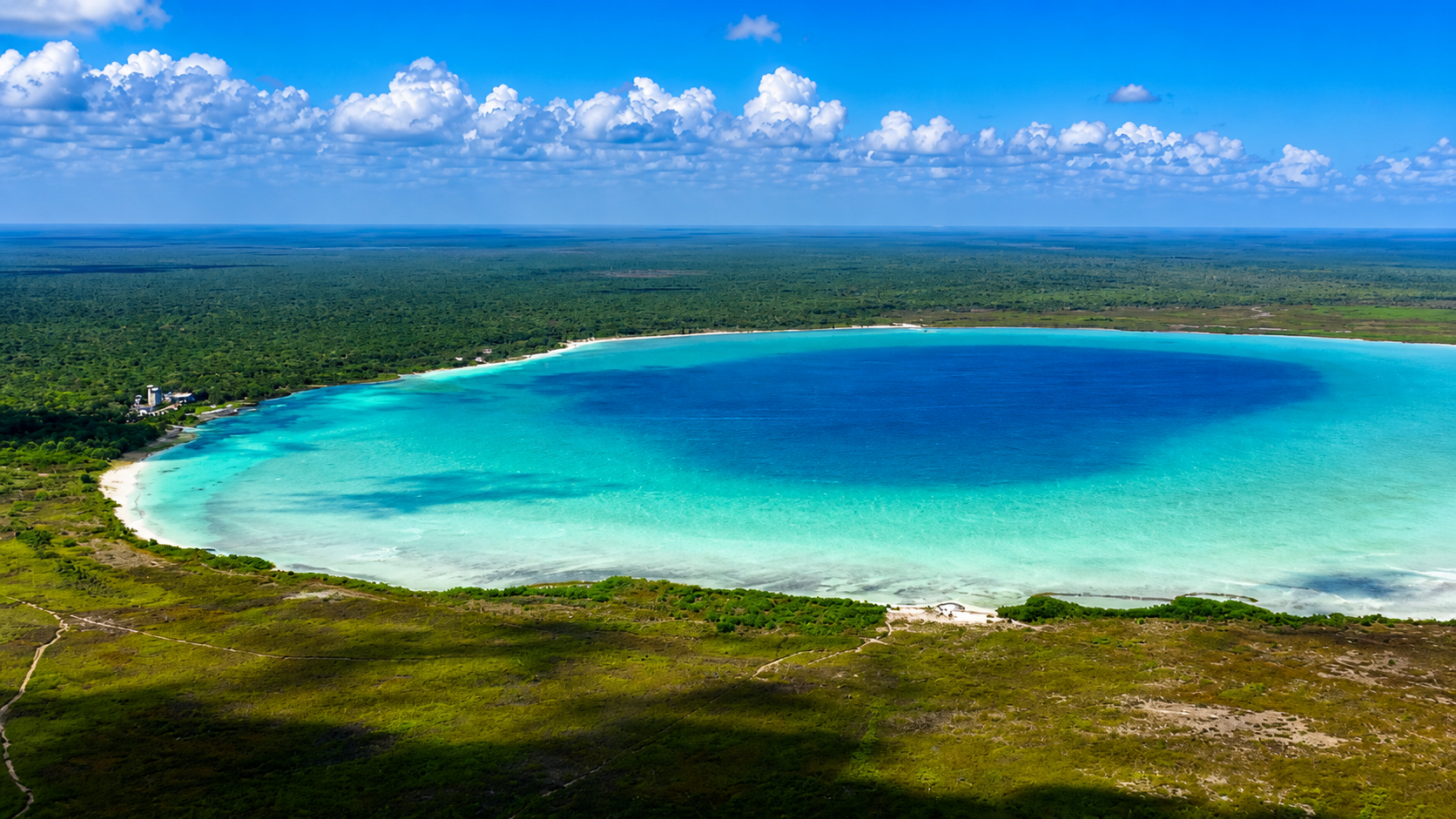 Turquoise lagoon framed by mangroves in the Sian Ka'an biosphere near Tulum, Mexico.