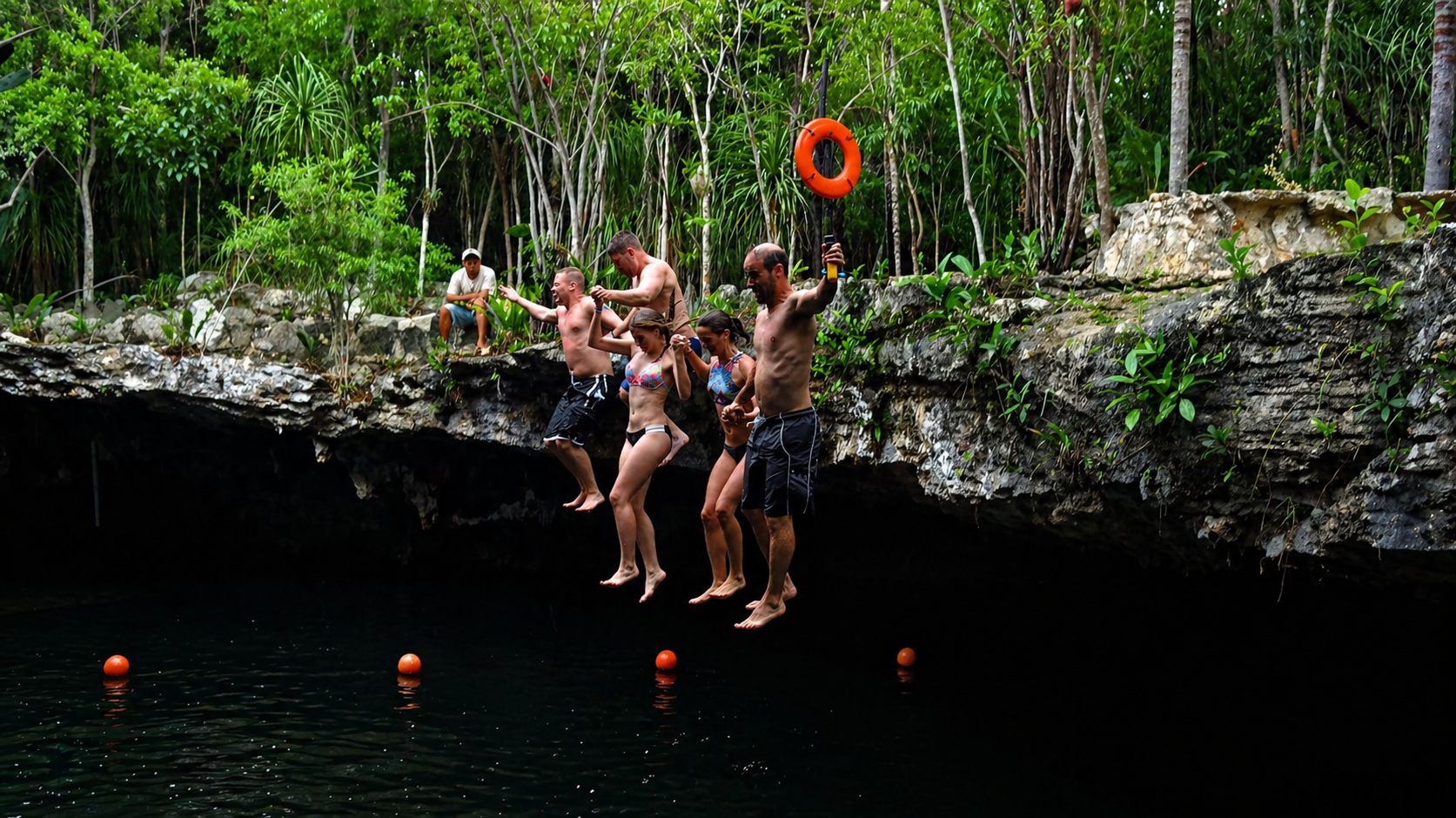 Cliff jump into a cenote